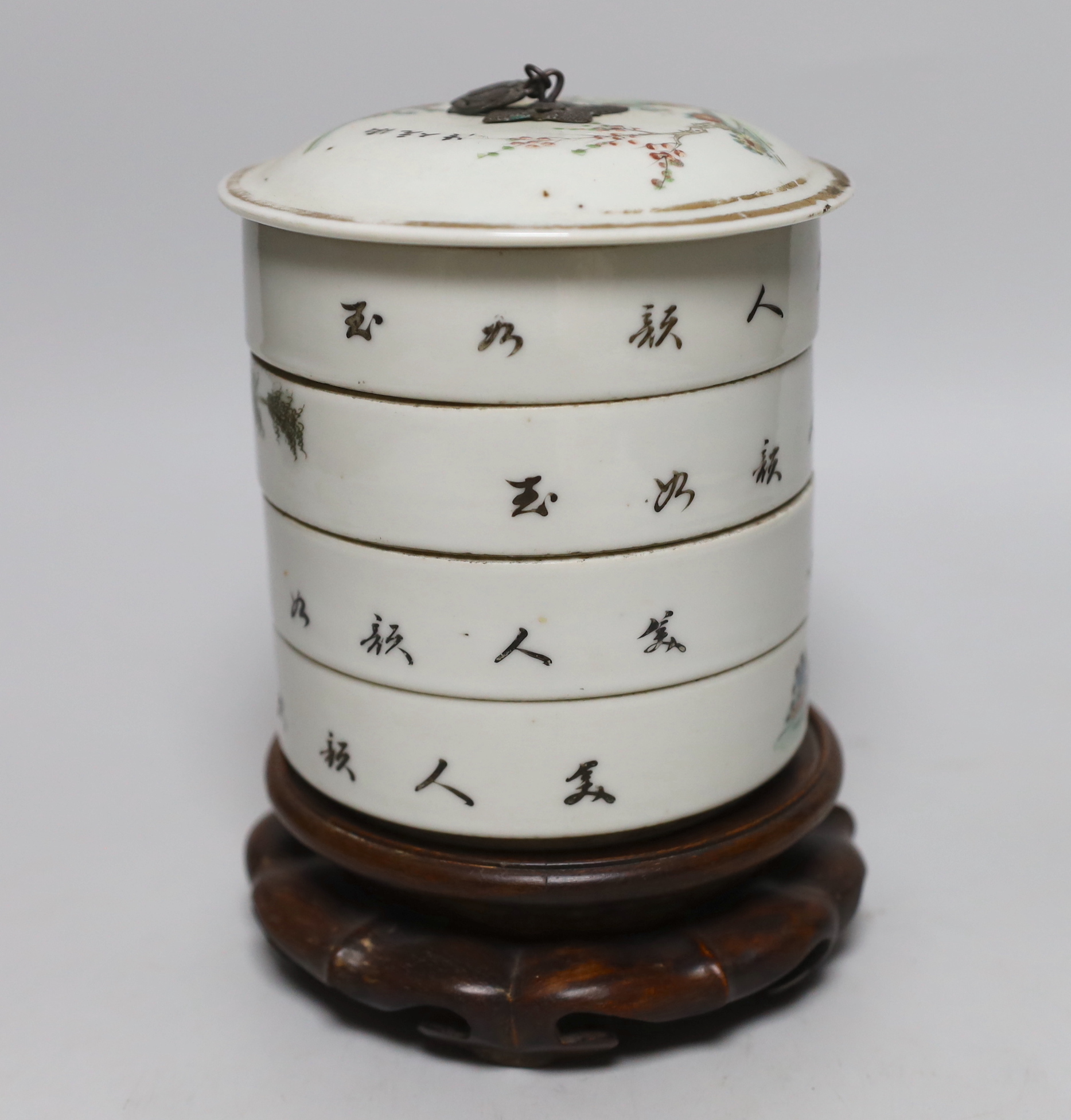 A set of early 20th century Chinese stacking containers on hardwood stand, 18cm